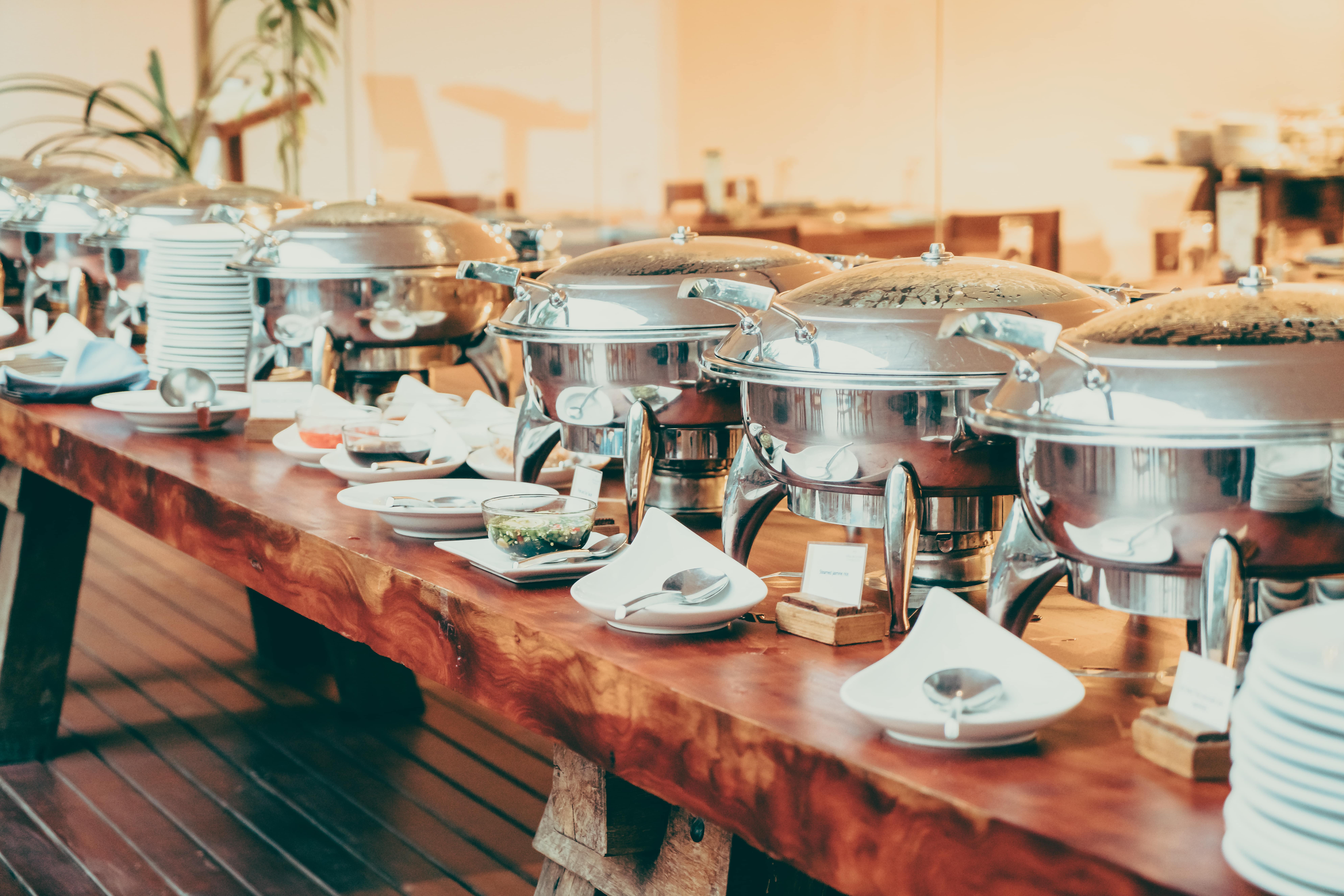 Professional catering setup with traditional serving dishes